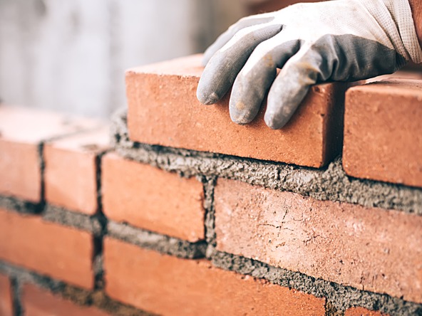 Brick building wall foundation_crop